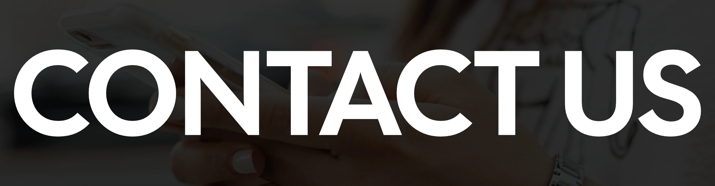 banner showing contact us text overtop of a person using cell phone